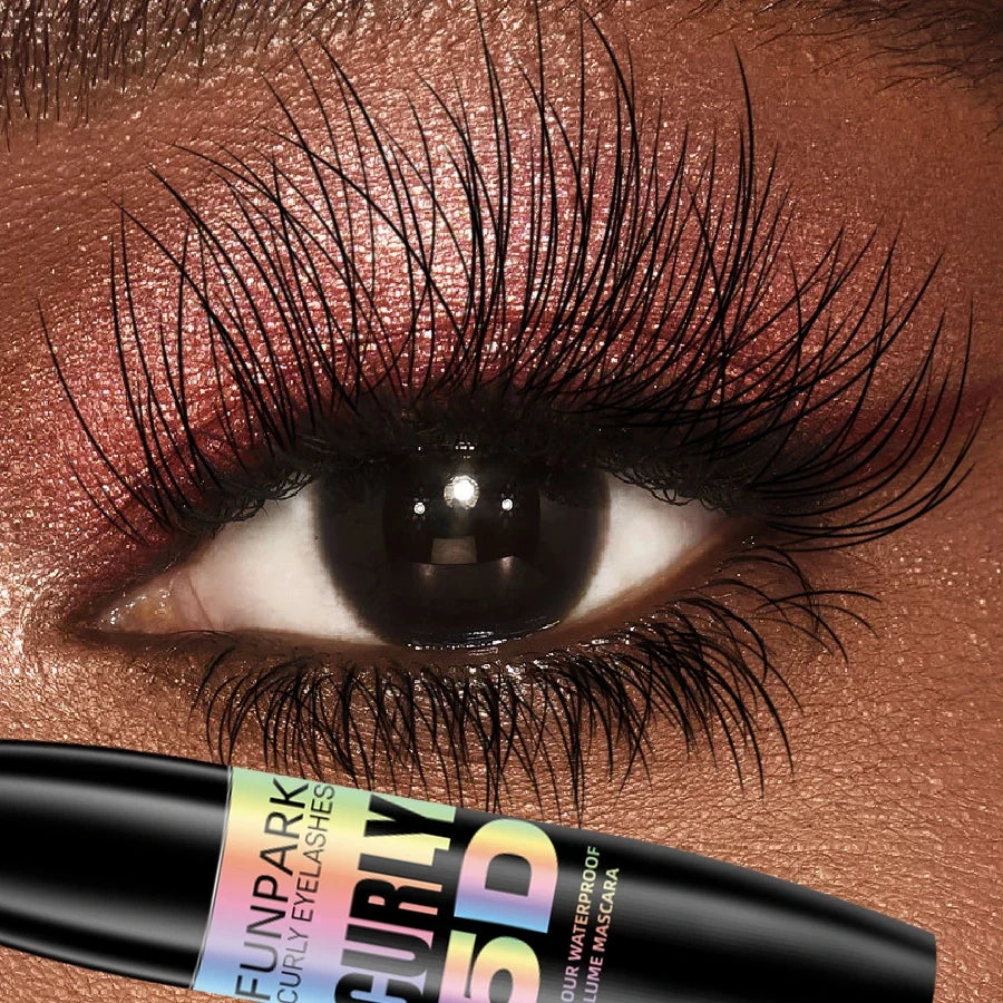 Black 5D fiber waterproof mascara by Blushimmer with thickening and lengthening effects, shown in close-up application on eyelashes.
