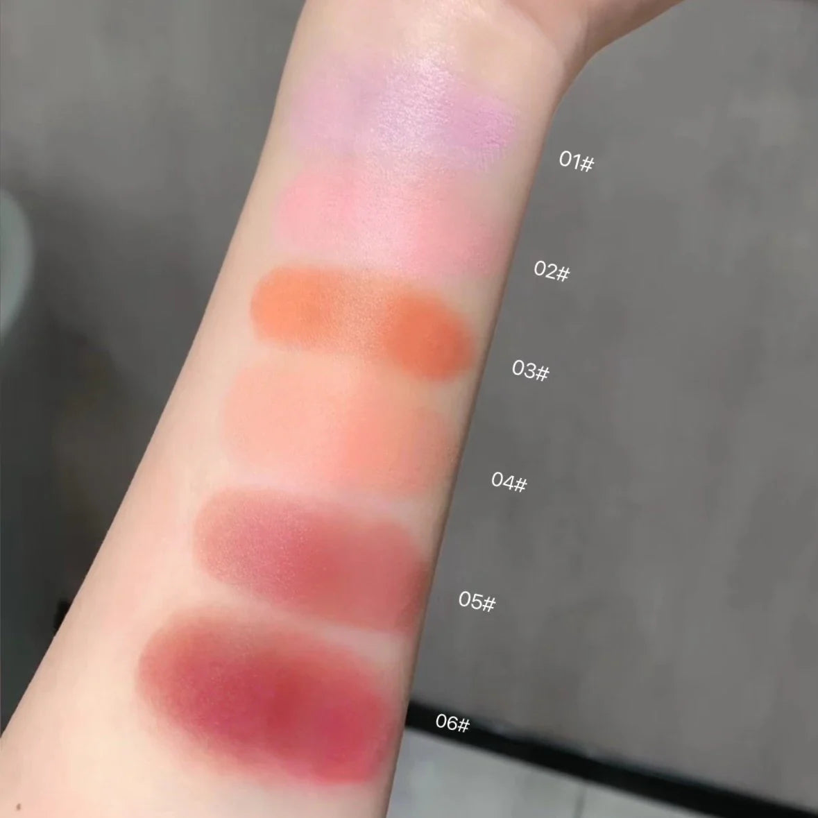 Creamy purple blush stick by Blushimmer featuring peach pink shade for natural cheek tint, brightening, and contouring.