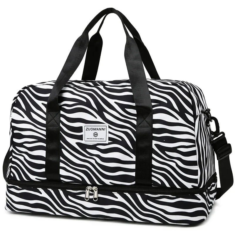 OBA women's zebra print carry-on travel bag with durable duffel bag design for gym and travel use.