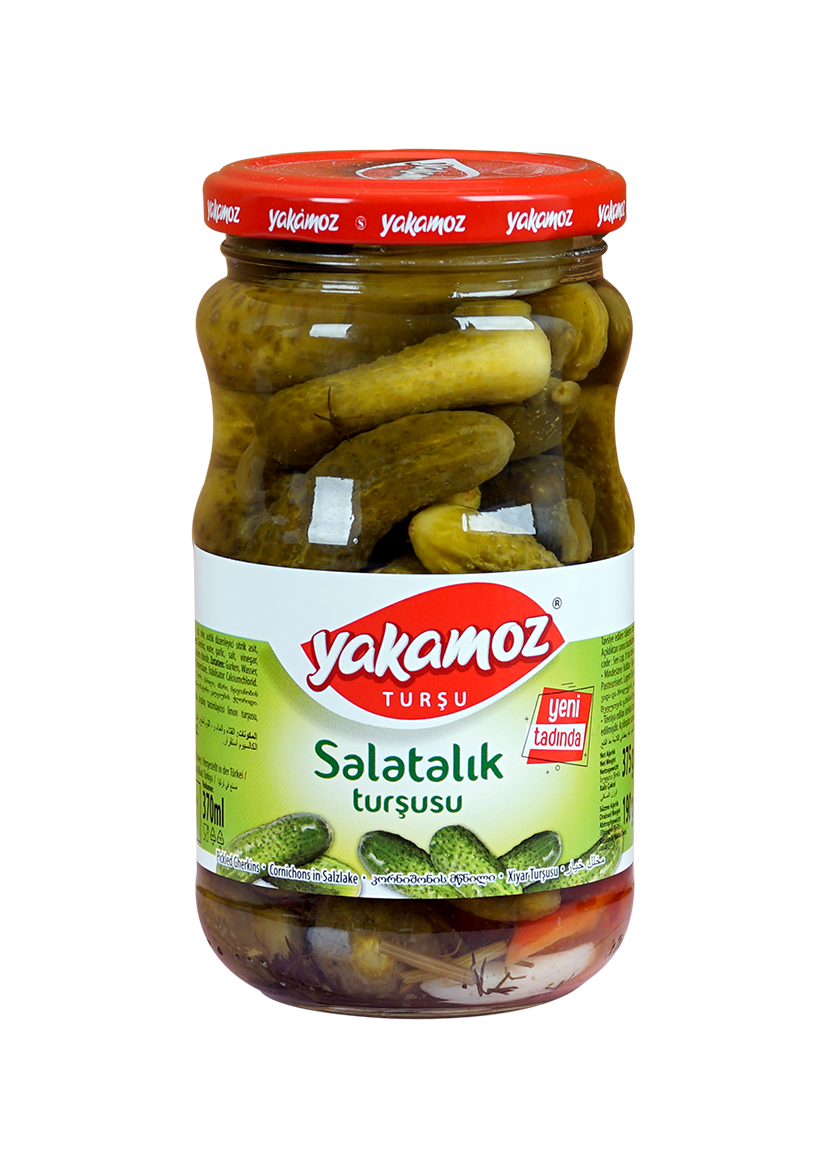 Glass jar of Yakamoz cucumber pickles from S101, filled with crunchy, sliced cucumber pickles in brine.