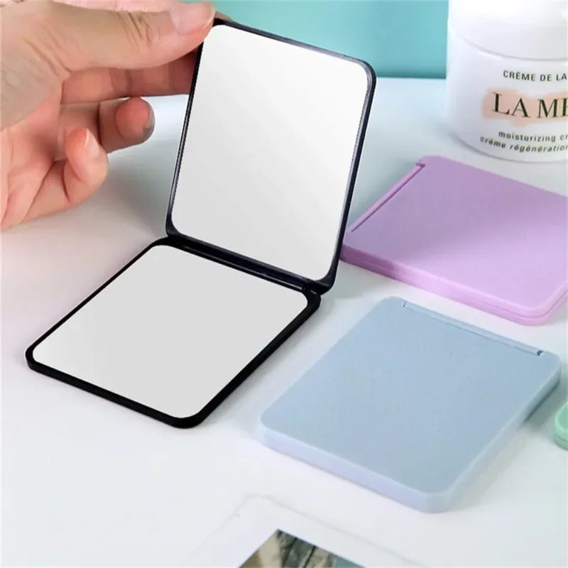 Portable double-sided foldable makeup mirror by Blushimmer, compact desktop design, ideal for students and small gift options.