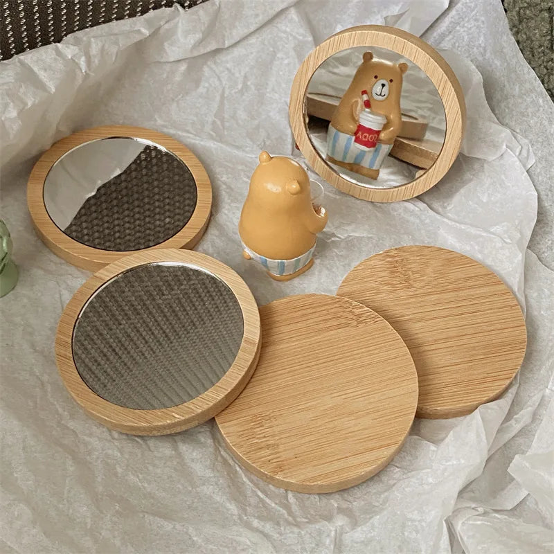 Blushimmer round portable cosmetic mirror, compact and lightweight for travel, ideal for makeup and beauty touch-ups.