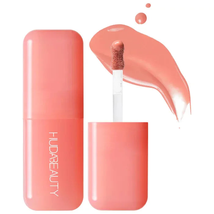 Blushimmer Huda Beauty Blush Filter liquid blush and shiny lip gloss in cotton candy and bubblegum shades, with concealer and lipstick.