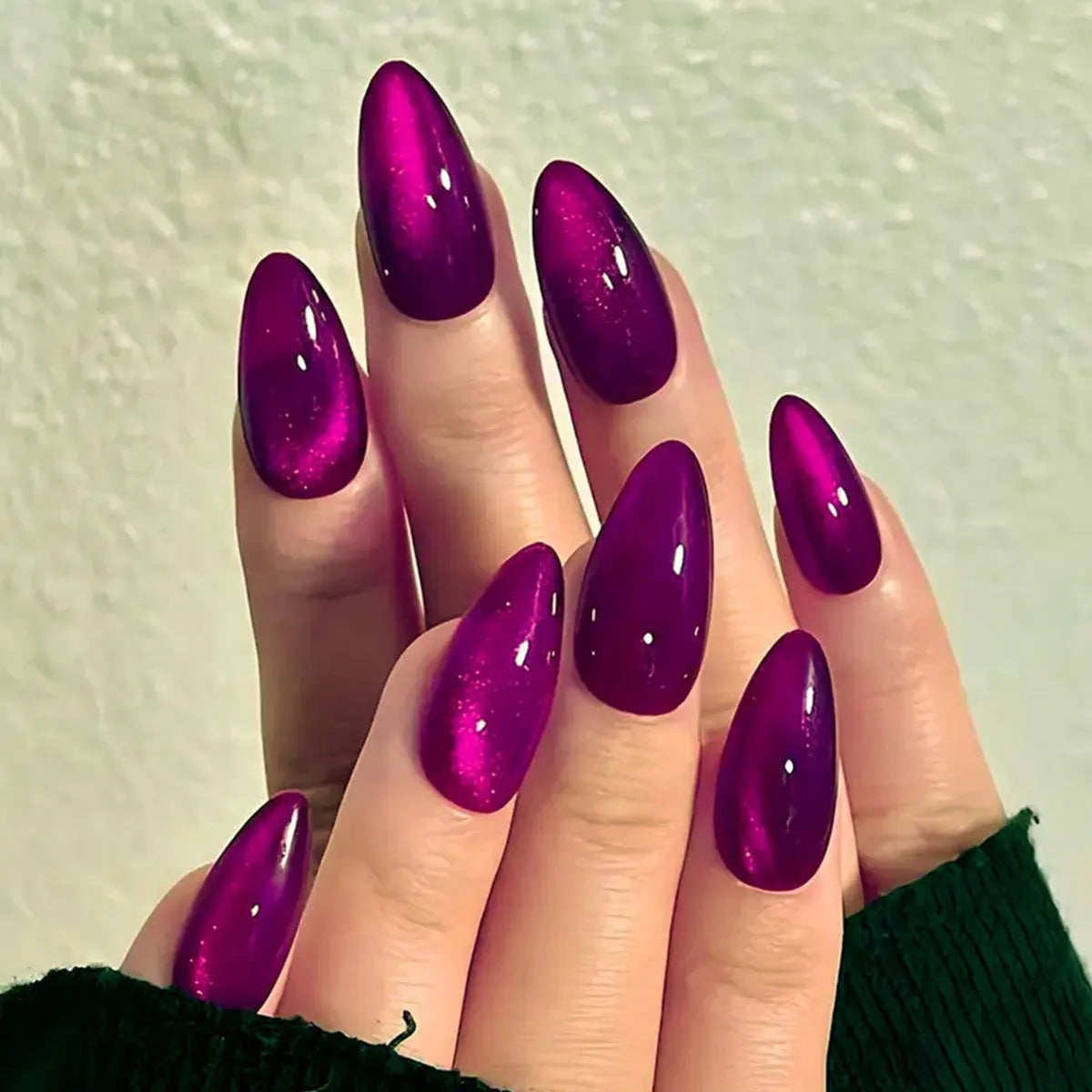Set of 24 glossy red Cat's Eye press-on nails by Blushimmer, almond shape, full cover nude color, suitable for easy, stylish wear.