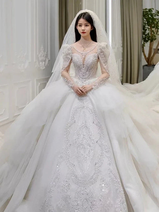 Elegant white wedding dress with ruffles and French-inspired design from EdleessFashion, featuring intricate details and luxurious fabric.