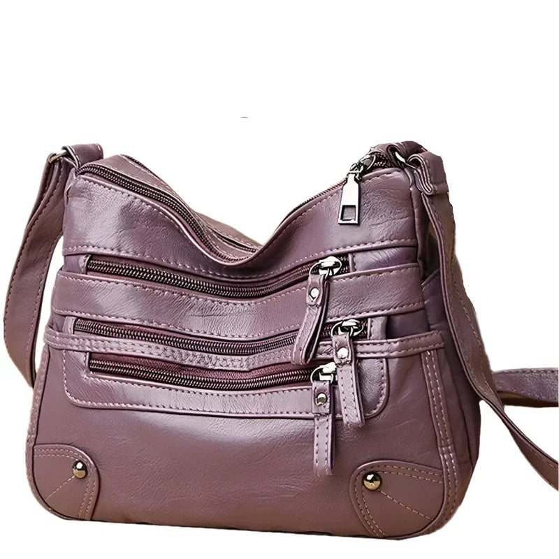 Purple women's multi-layer leather shoulder crossbody bag by LPO with multiple compartments and adjustable strap.