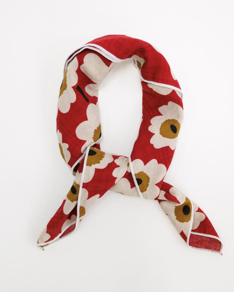Light, breathable Downeast Essential Summer Scarf in vibrant colors, styled loosely on a model for warm-weather wear.