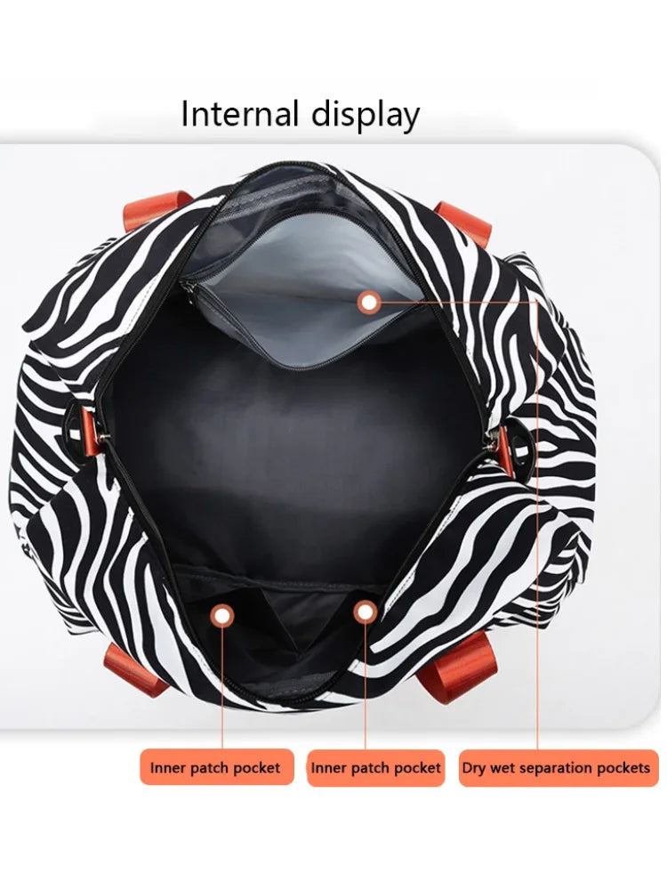 OBA women's zebra print carry-on travel duffel bag with handles for gym and travel use.