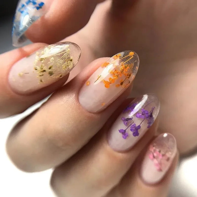 Blushimmer pink dried flower gel nail polish with natural fairy flower design, UV and LED soak-off nail art gel for manicures.