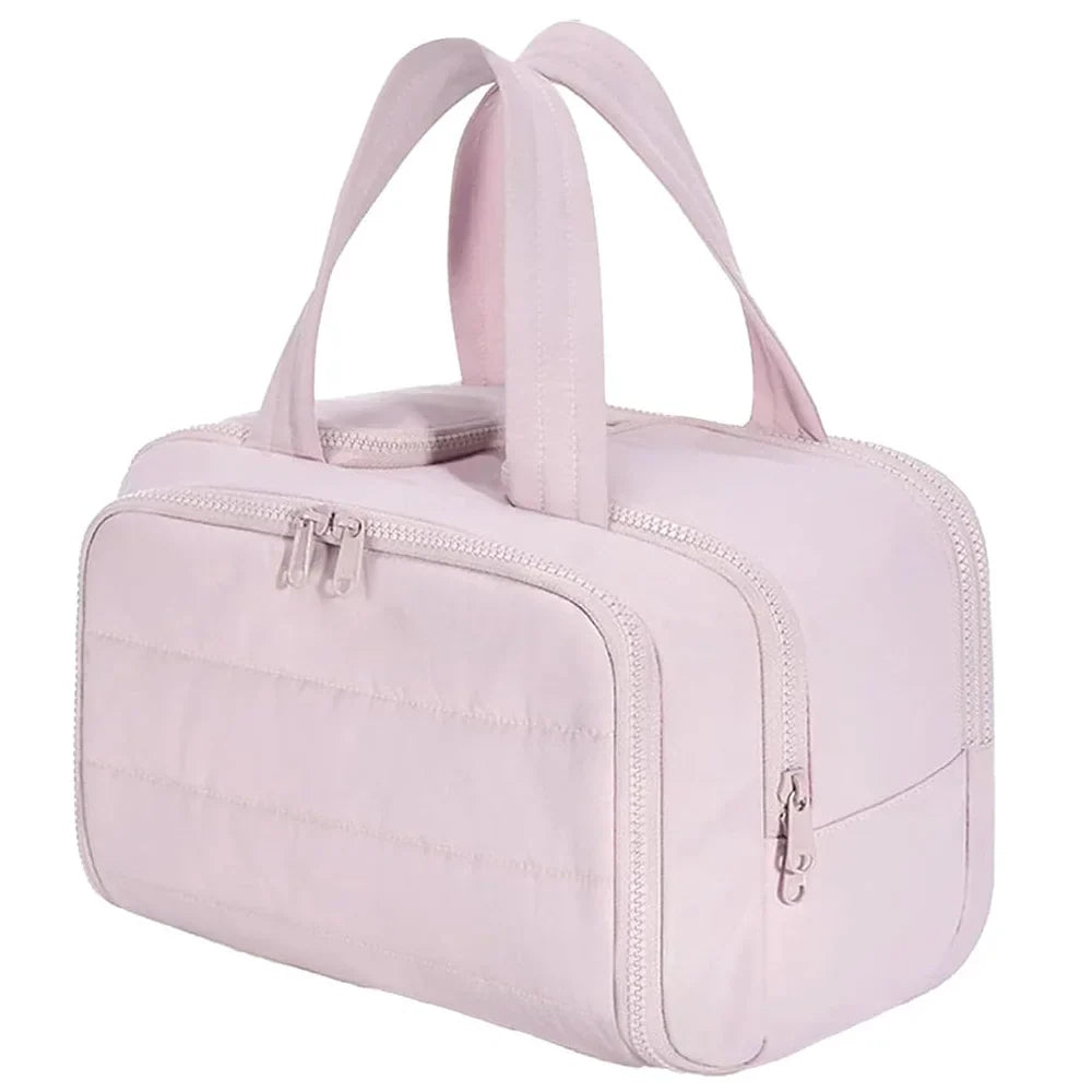 Large waterproof Blushimmer cosmetic bag with multiple compartments, ideal for travel toiletries and makeup organization.
