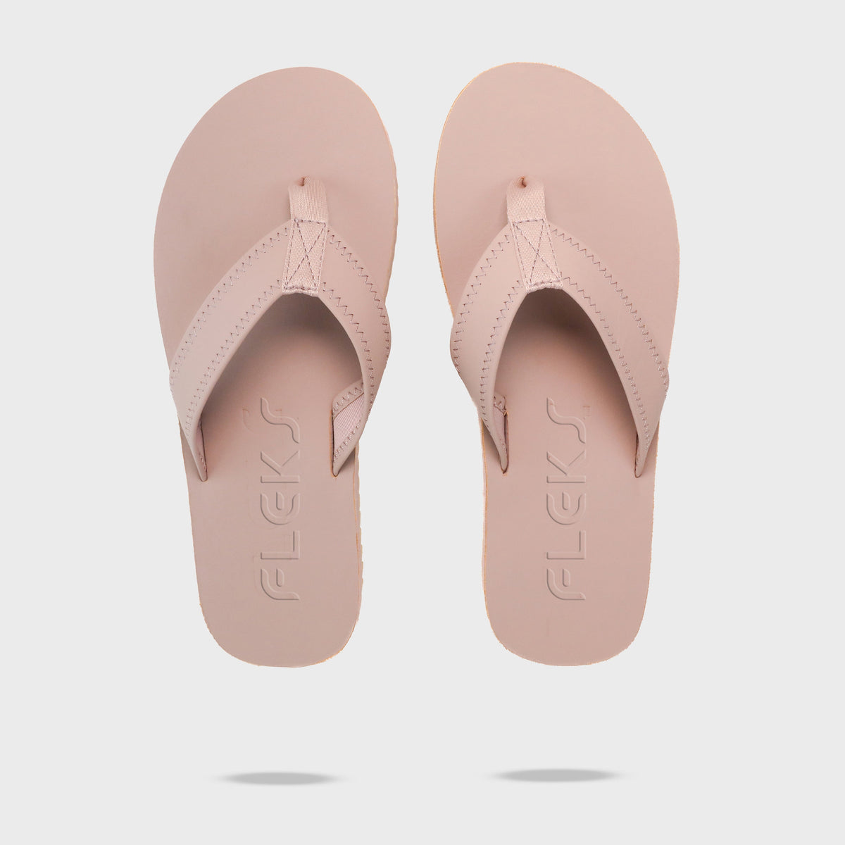 Seagrove Flip Flop by Fleks in Blushed color, featuring a comfortable strap and flip flop sole, with Fleks logo on the strap.
