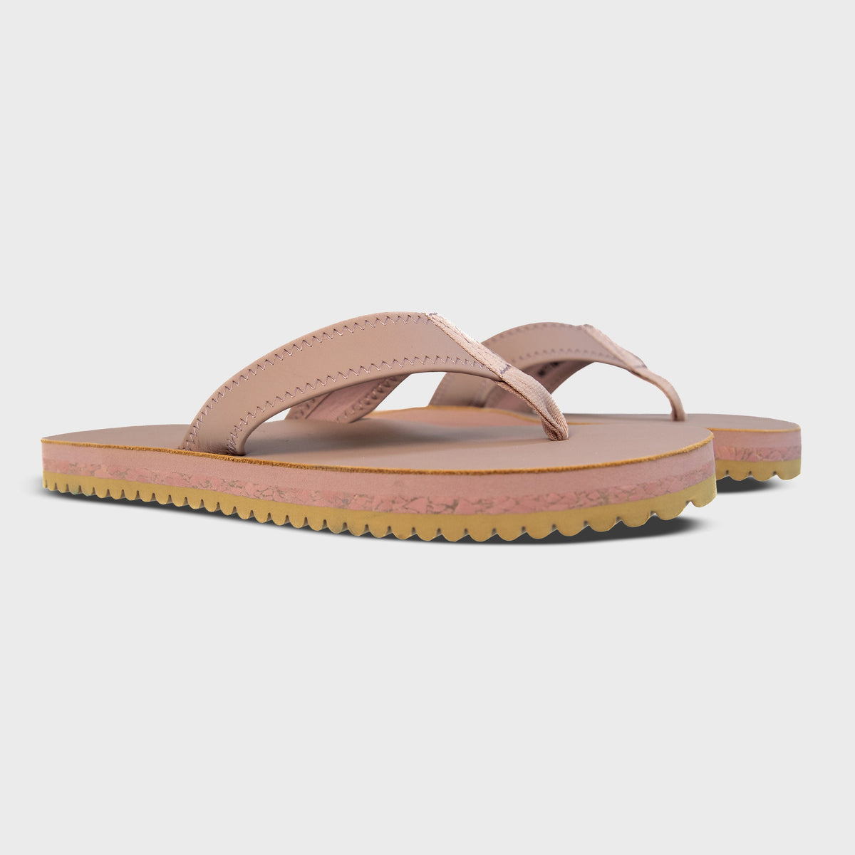 Pair of Fleks Seagrove Flip Flops in Blushed color, showing side profile and comfortable strap design.