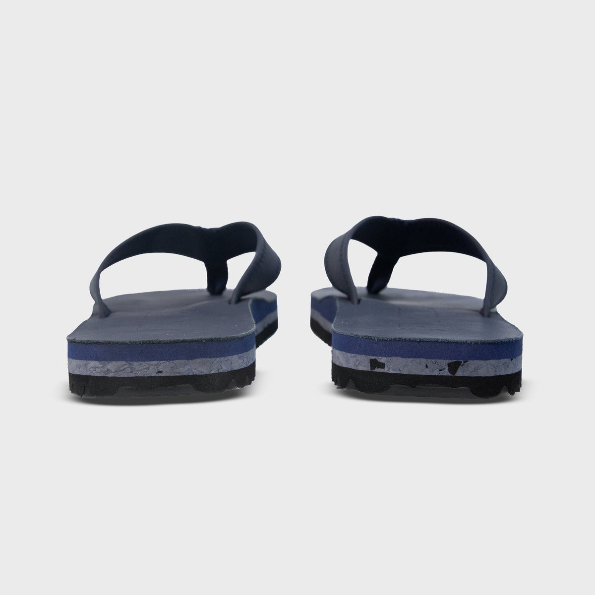 Rear view of Fleks Seagrove Flip Flops in deep blue sea color, showing the comfortable footbed and stylish strap design.