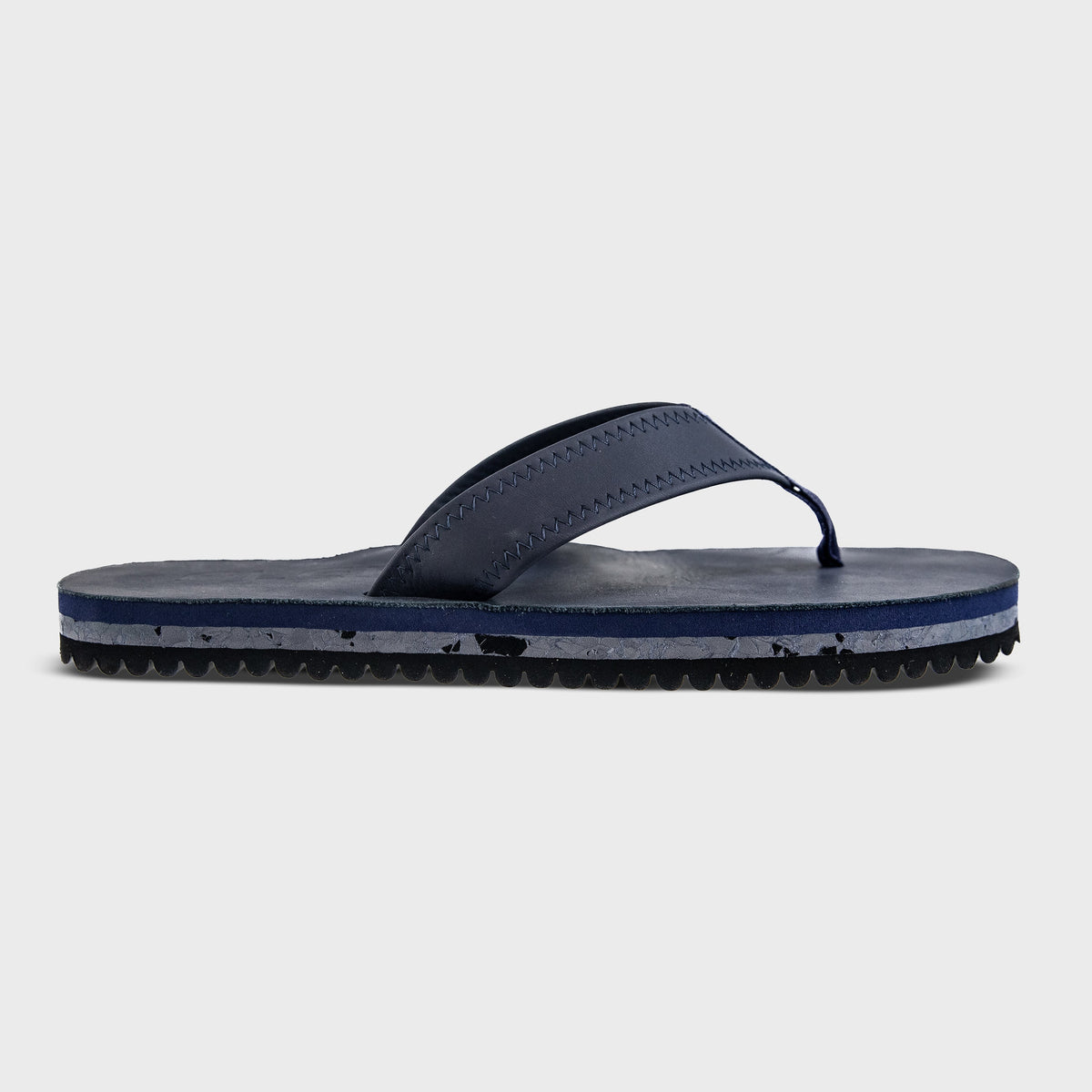Fleks Seagrove Flip Flop in deep blue sea color, showing a single profile view of the casual beach footwear.