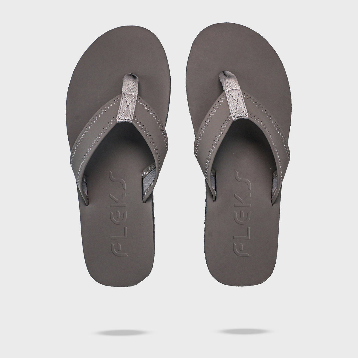 Pair of Fleks Seagrove Flip Flops in Nightfall color, top-down view showing the logo and comfortable sandal design.