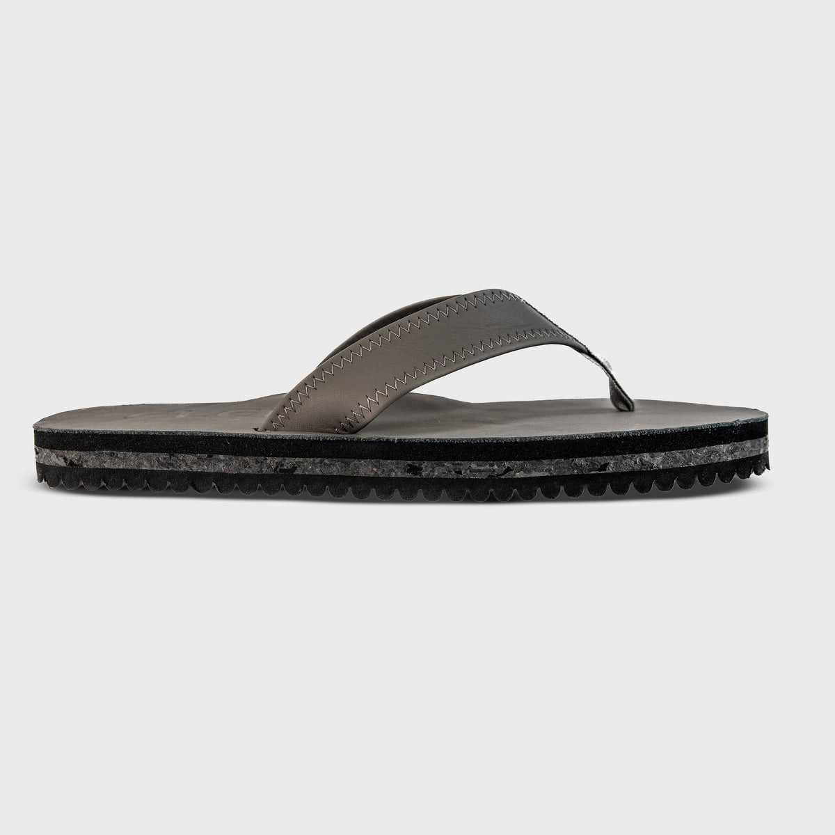 Fleks Seagrove Flip Flop in Nightfall color, featuring a single profile view of the casual slip-on sandal with textured sole.