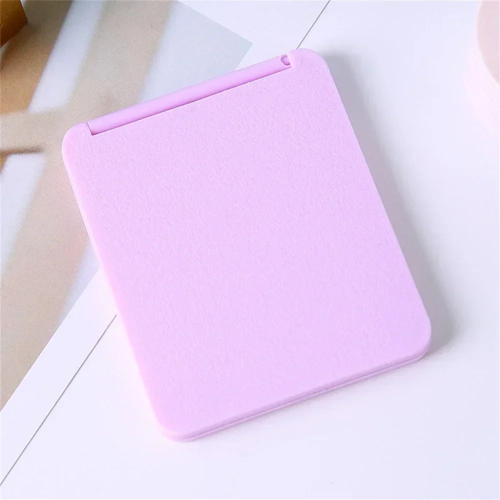 Portable foldable double-sided makeup mirror by Blushimmer, compact and suitable for dorms or gifting.