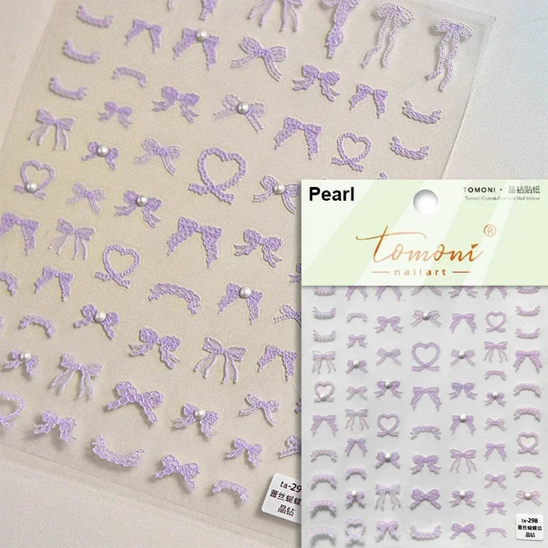 White and black French leopard print bowknot nail art stickers with rhinestones and pearls, perfect for elegant manicure decoration.