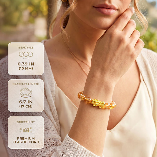 Close-up of the Conscious Items Ultimate Wealth Bracelet showing its sleek design and adjustable fit on a neutral background.