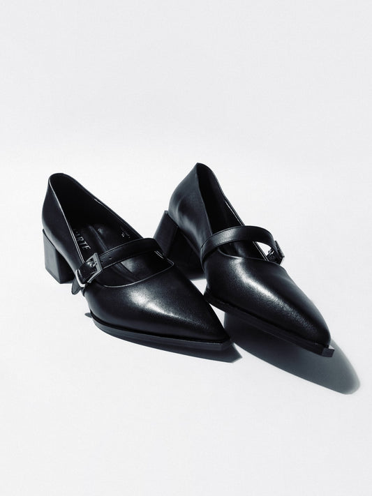 Black women's leather shoes by L'ARTE MILANO with sleek design and stylish ankle straps, perfect for elegant footwear.
