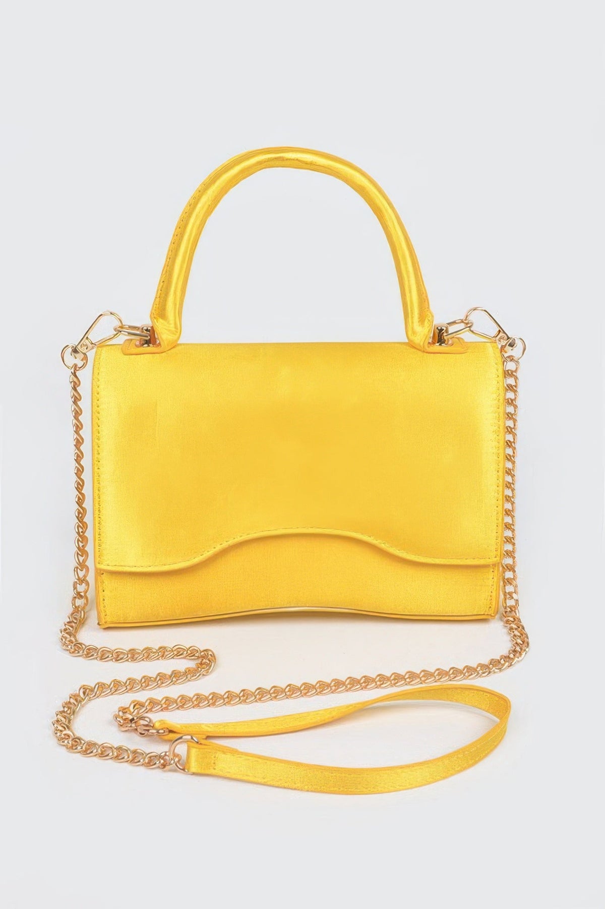 Women's black leather handbag by BYMANYC New York from the Cala Llenya collection, featuring elegant design and gold accents.