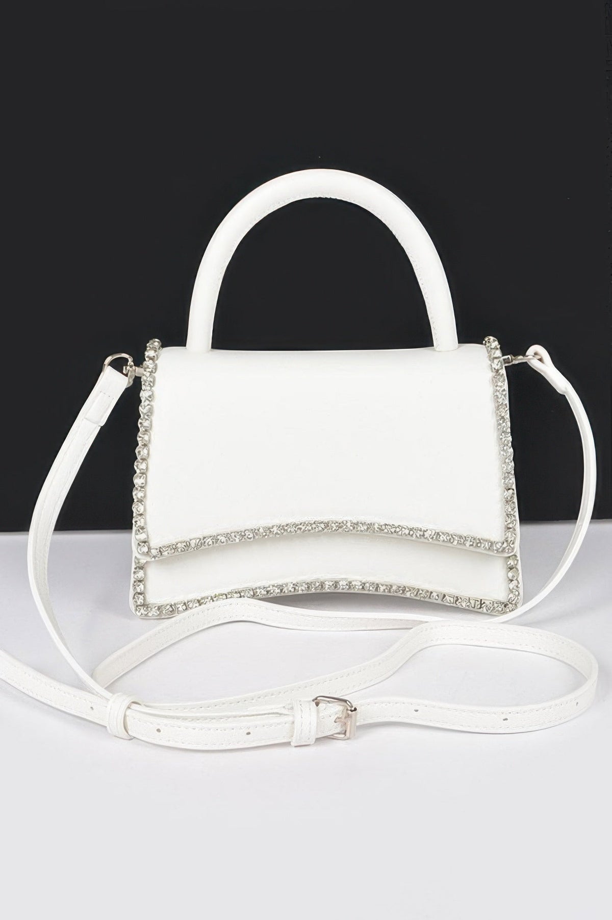 Women's UPPER WEST top handle flap handbag by BYMANYC New York, stylish leather bag with a sleek top handle and flap closure.