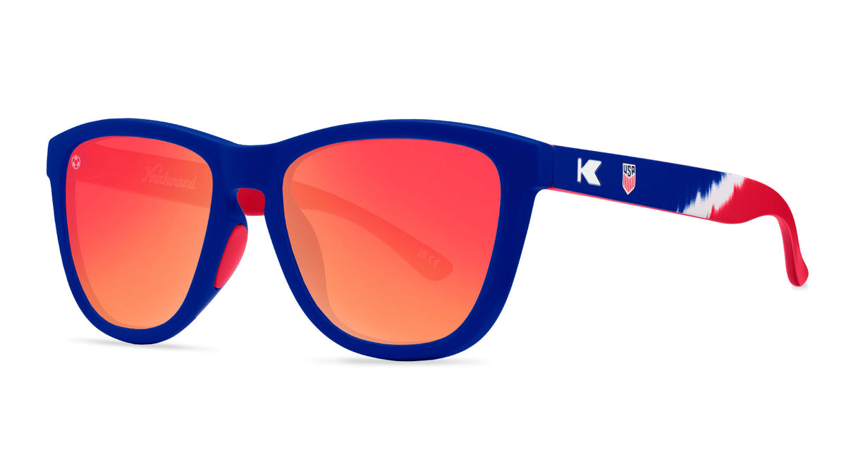 U.S. Soccer 2024 Knockaround sunglasses by Goal Five shown in a lifestyle setting, featuring stylish design and three-quarter view.
