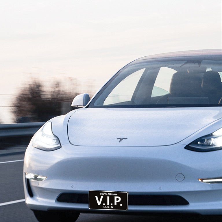 American standard front license plate frame for Tesla Model 3 and Model Y, durable metal design with clear mounting holes.