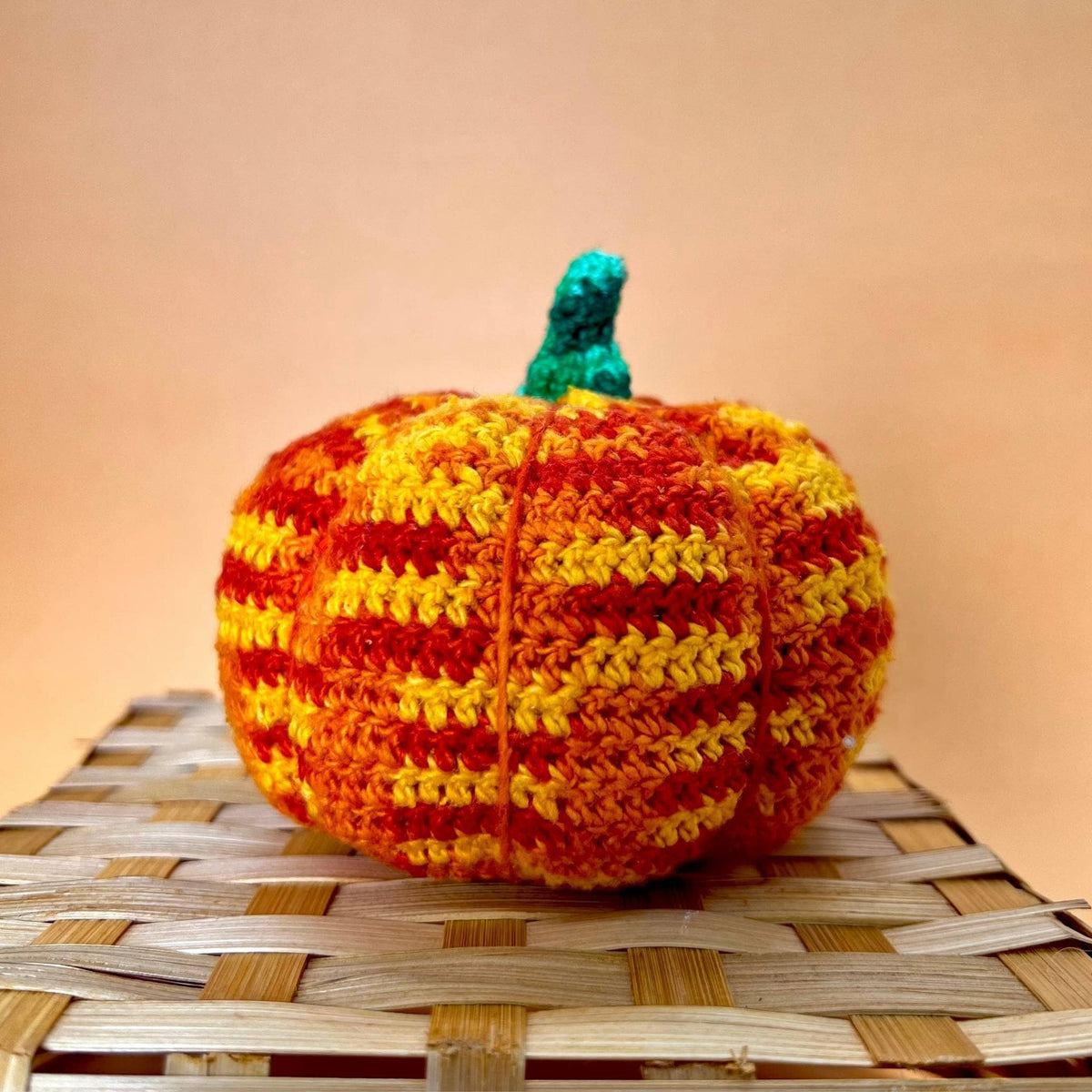 Crochet pumpkin amigurumi kit by Darn Good Yarn featuring eco-friendly yarn for fall-themed crochet decor.