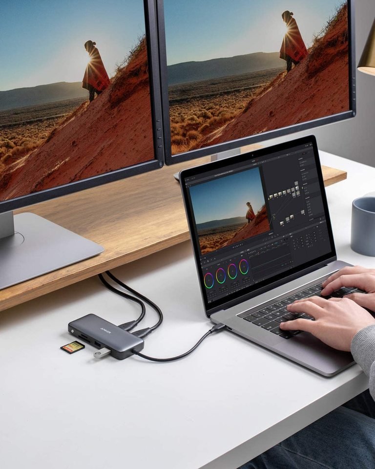 Anker 553 USB-C Hub in black, showing multiple ports for charging and data transfer, with a sleek compact design.