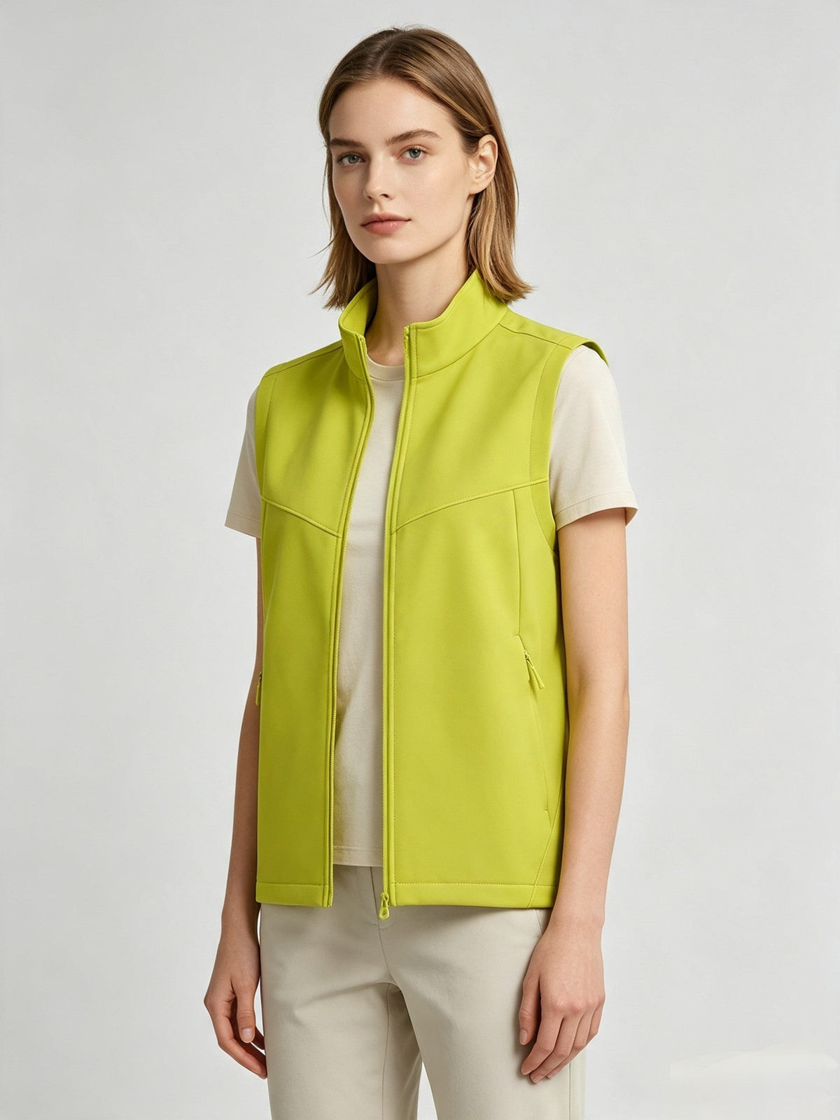 Men's and women's softshell vest with stand collar, zip front, windproof water-resistant fleece lining, and sleeveless design