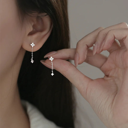 Silver color inlaid zircon clover tassel earrings for women, delicate chain pendant jewelry, perfect for parties and gifts.