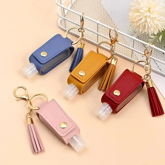 Leather keychain holder for portable, leakproof hand sanitizer bottle, perfect for travel and everyday use.