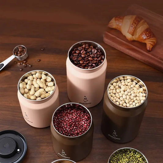 Stainless steel press-type coffee bean storage tank with vacuum seal, ideal for coffee beans, tea, grains, and candies.