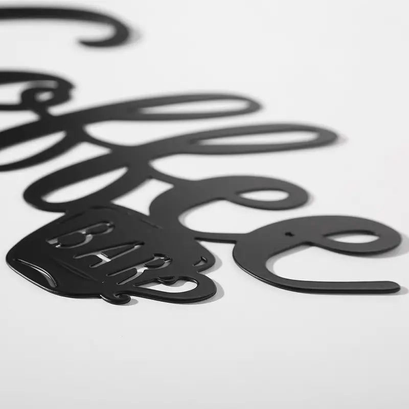 Black hanging coffee wall sign with metal coffee cup decor, perfect for kitchen or coffee shop wall decoration.