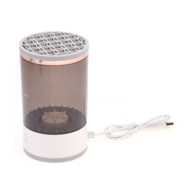 Black rechargeable makeup brush cleaner by BackupMyFilesNow.com with multiple brush slots and digital display.
