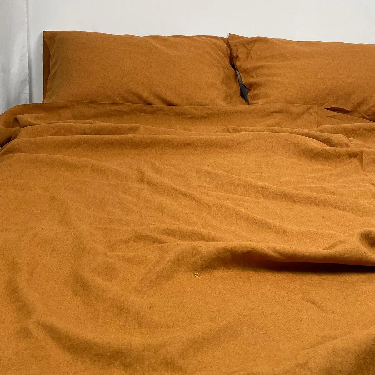 BackupMyFilesNow 4-piece linen bed sheet set with flat sheet, deep pocket fitted sheet, and pillowcases in flax color.