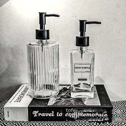 Clear 450ml portable glass hand sanitizer and soap dispenser for bathroom or travel use, with pump and refillable design.
