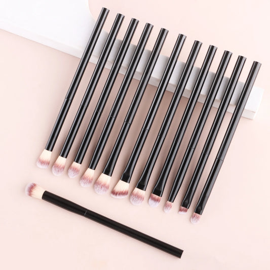 12-piece eyeshadow makeup brush set with soft synthetic hair, including blending, shader, angled, and liner brushes for eye makeup.