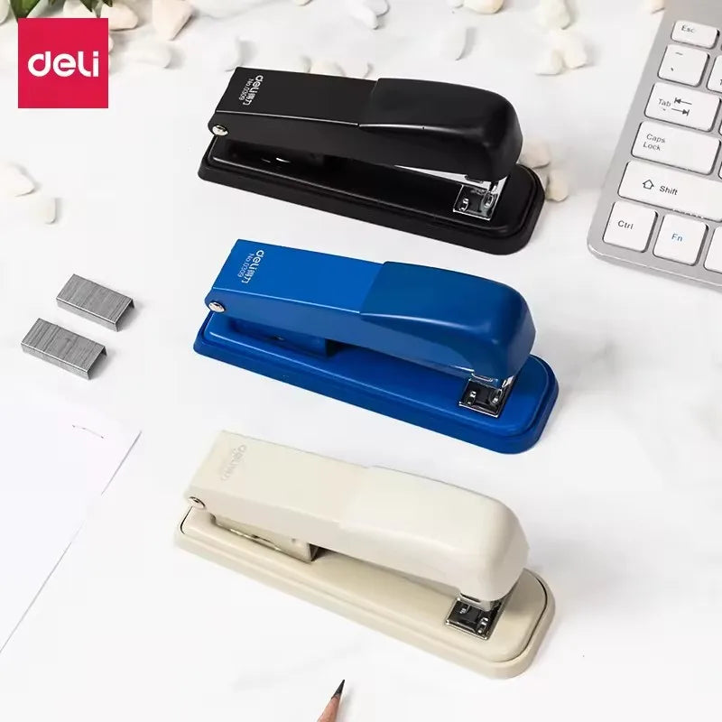 White, black, and blue Deli 0309 manual stapler with metal body, shown in a set of 96 for office, school, or home use.