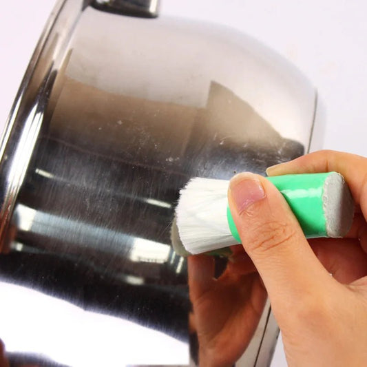 Stainless steel pan cleaning brush from BACKUPMYFILESNOW.COM® for household kitchen and metal cleaning tasks.