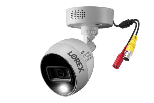 Lorex C883DA 4K Ultra HD security camera with active deterrence and color night vision, refurbished, mounted outdoors.