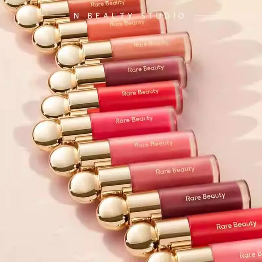 Rare Beauty liquid blush in porcelain shade, silky smooth, easy to blend, high-gloss finish, enhances makeup texture and glow.