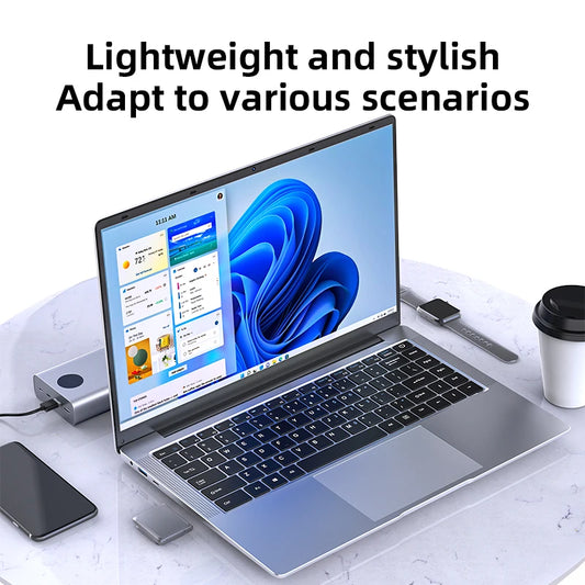 Silver 14.1-inch Intel Atom A3950 laptop with Windows 11 Pro, 12GB RAM, 512GB SSD, 1TB HDD, full HD display.