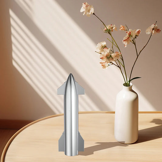 Silver SpaceX Starship rocket model with metallic texture, featuring Dragon spacecraft and Falcon rocket, desktop ornament for NASA fans.