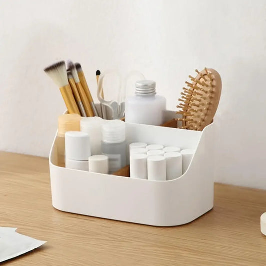 White plastic desk storage box for office supplies, makeup, and cosmetics, with dividing compartments for organized desktop storage.