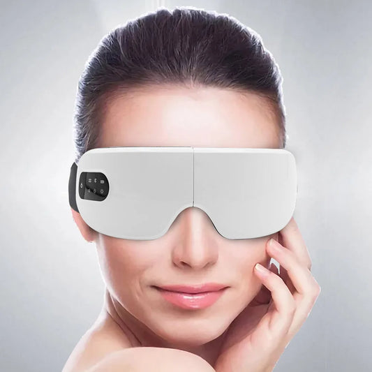 White smart electric eye massager glasses with air pressure, hot compress, Bluetooth music, foldable design, and USB rechargeable feature.