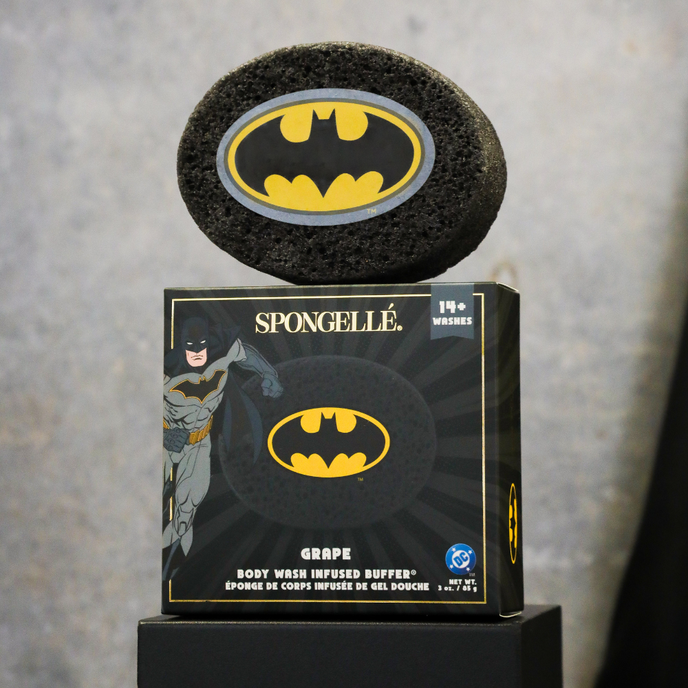 Batman Grape Body Buffer by Spongellé, a DC superhero body wash infused buffer featuring a Batman design with vibrant purple accents.