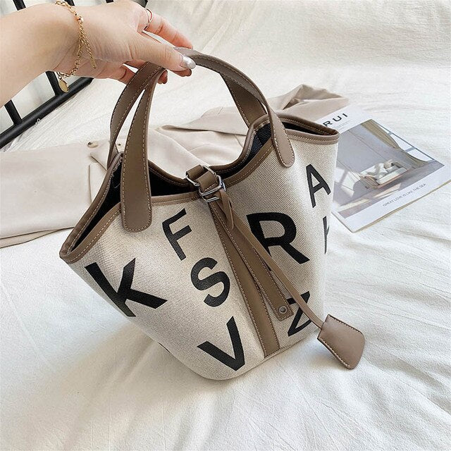 Women's letter printed canvas tote bag by BACKUPMYFILESNOW® with stylish design and spacious interior for everyday use.