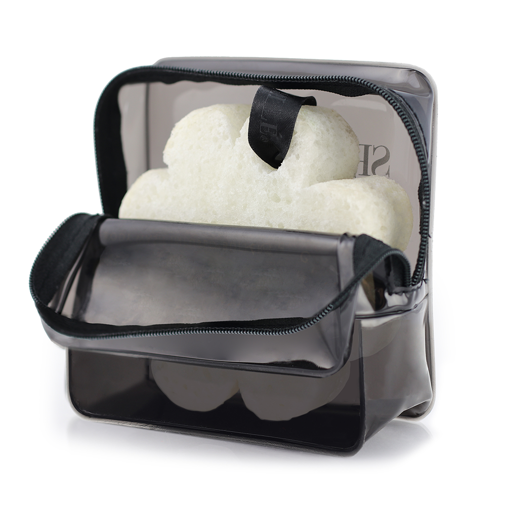 Black Spongellé travel case with zip closure, designed for storing toiletries and small travel essentials.